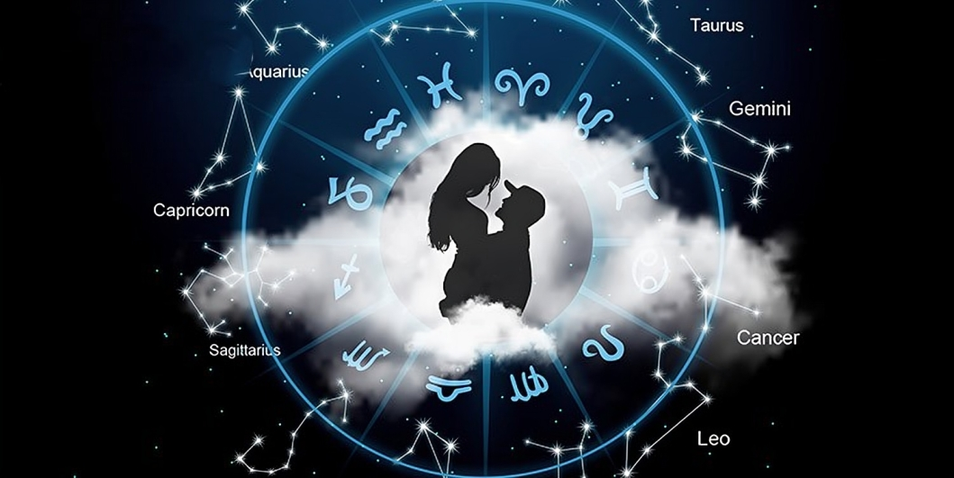 A Silhouette of Couple with Zodiac circle in Background.